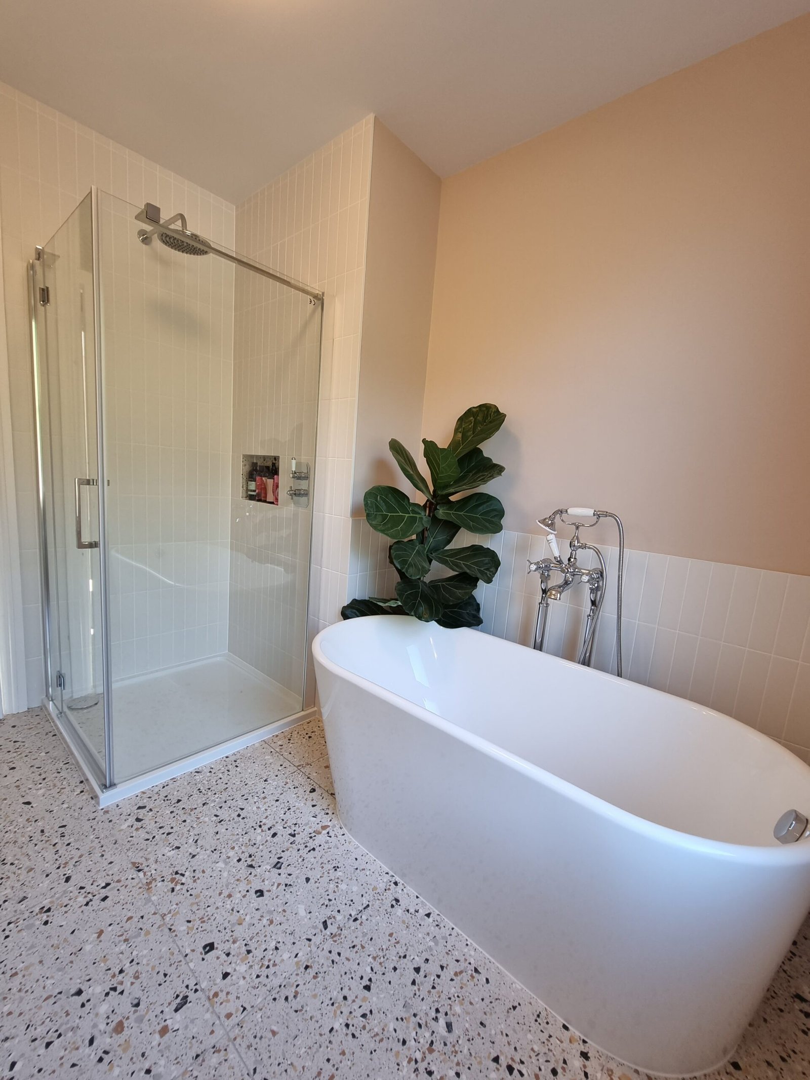 Family bathroom vanity, towel rail and freestanding bath