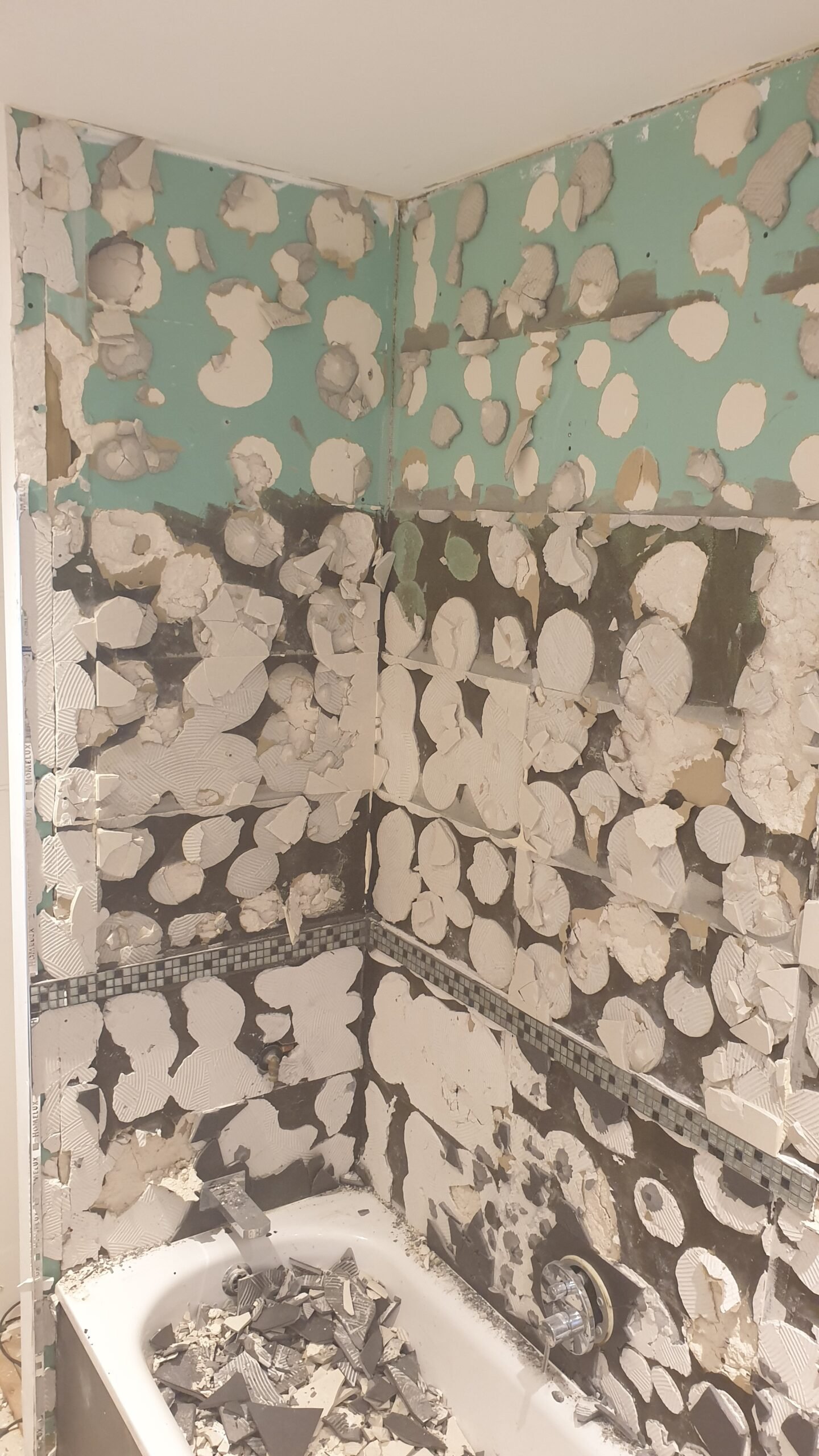 Moisture damage behind tiles — bathroom refurbishment failure