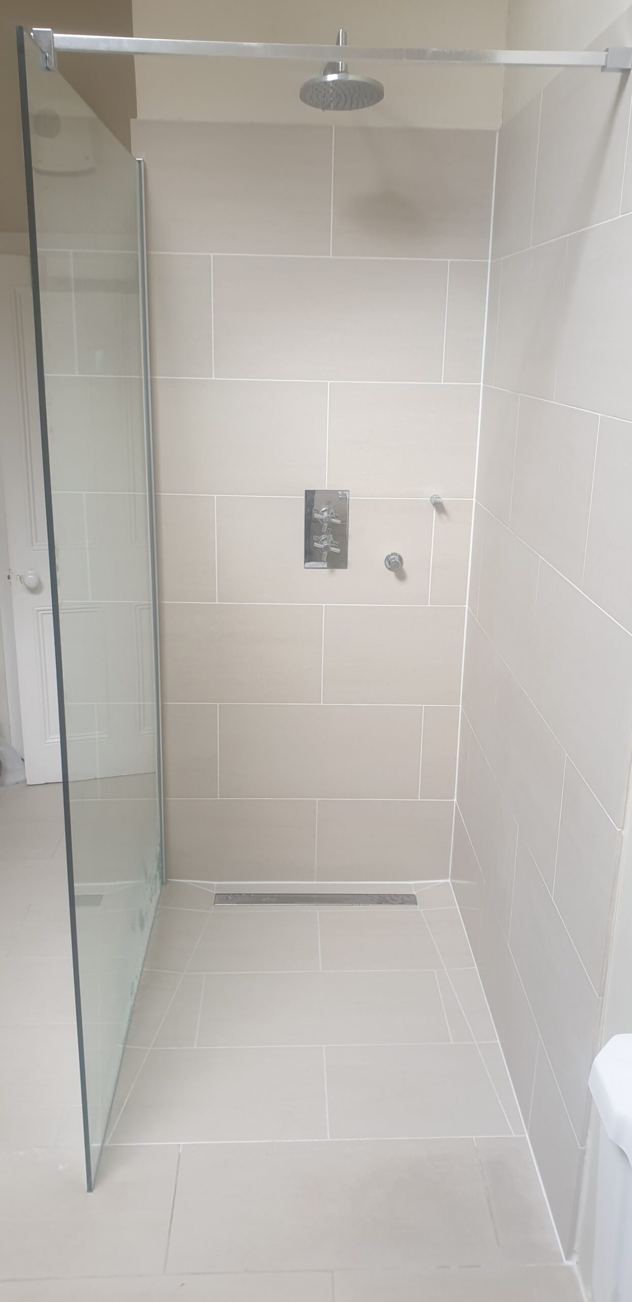 Wet room installation stage — tiling in progress North London