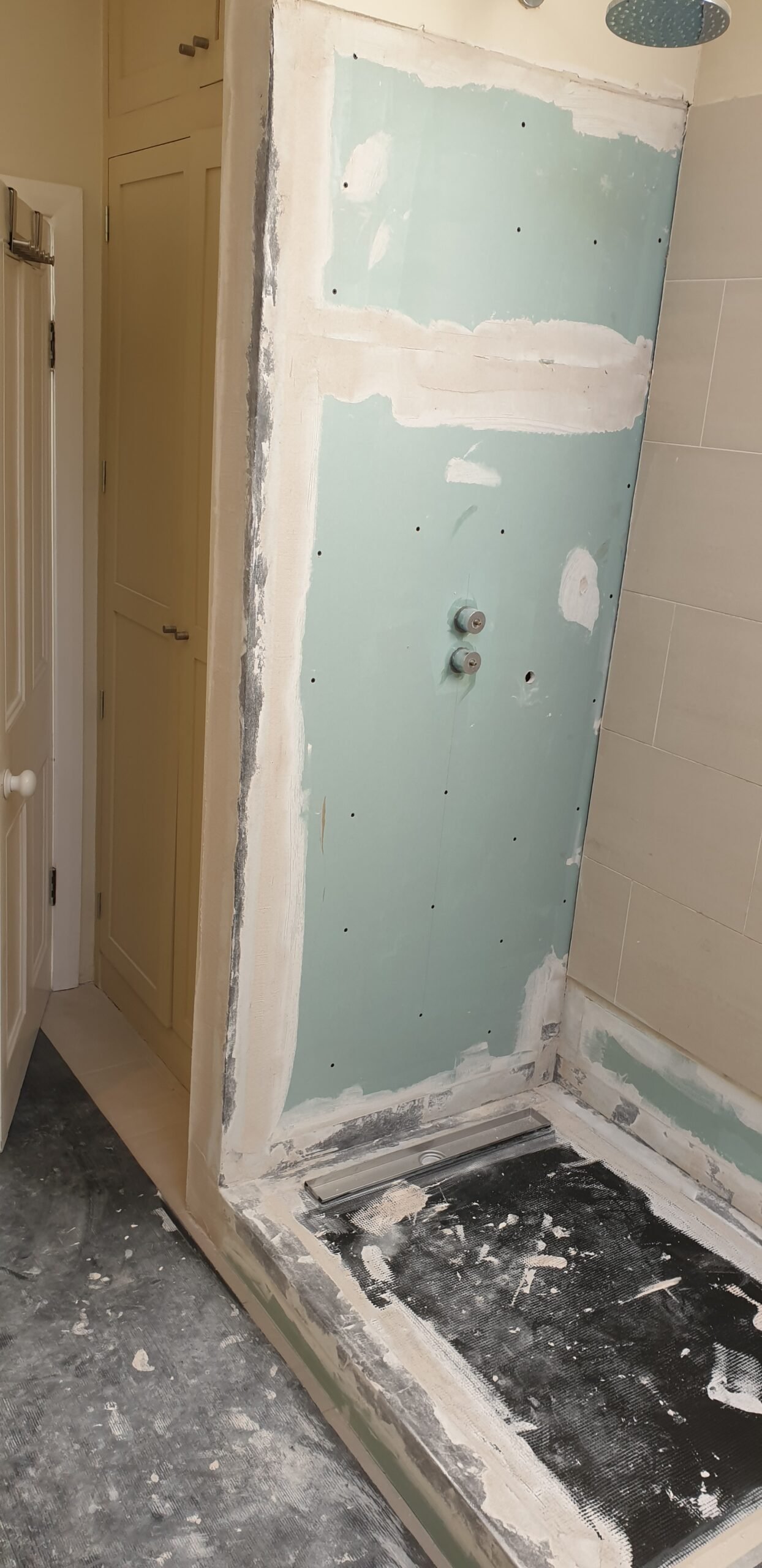 Wet room subfloor preparation — what actually matters underneath