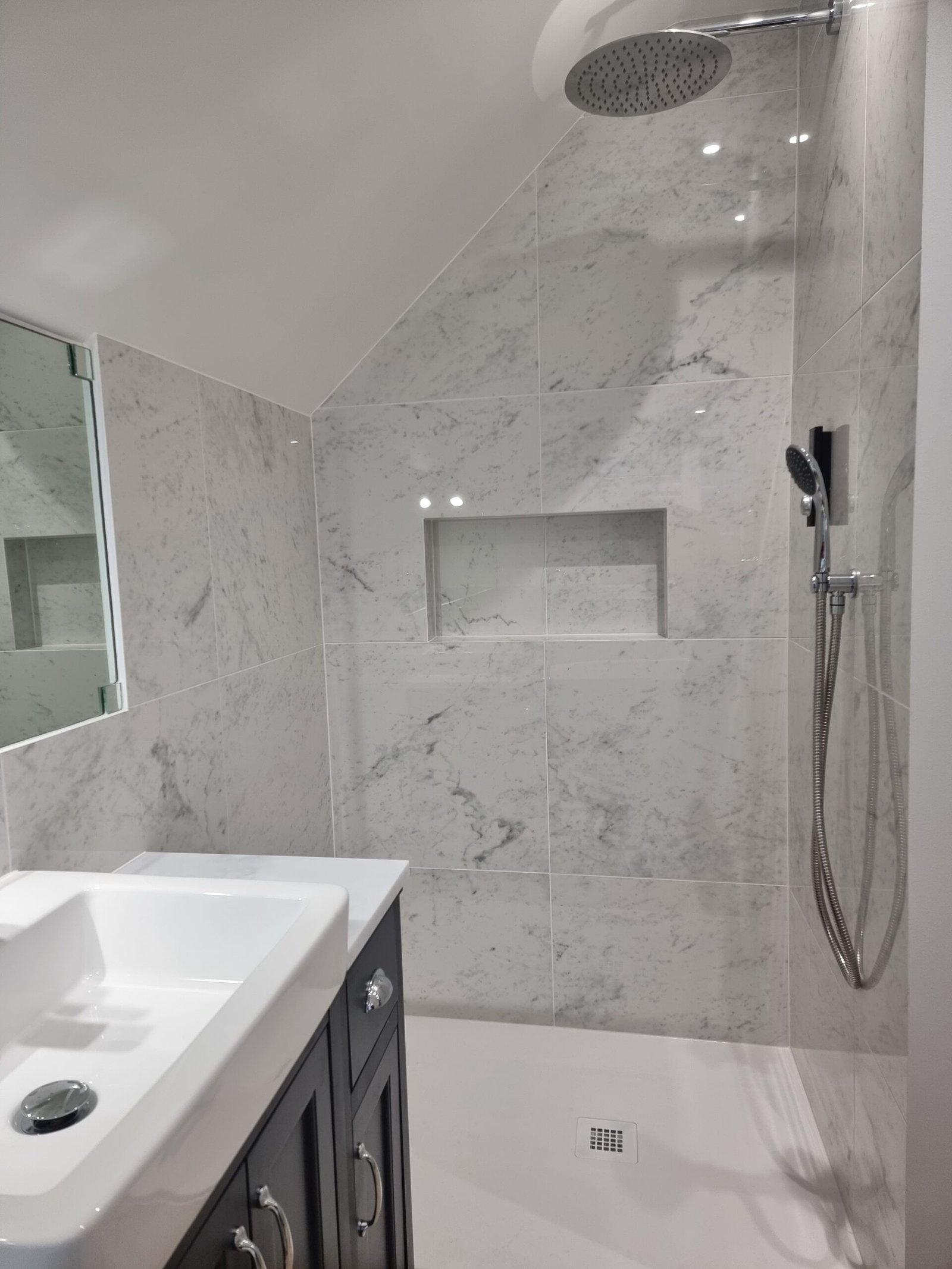 Family bathroom porcelain shower with niche, North London