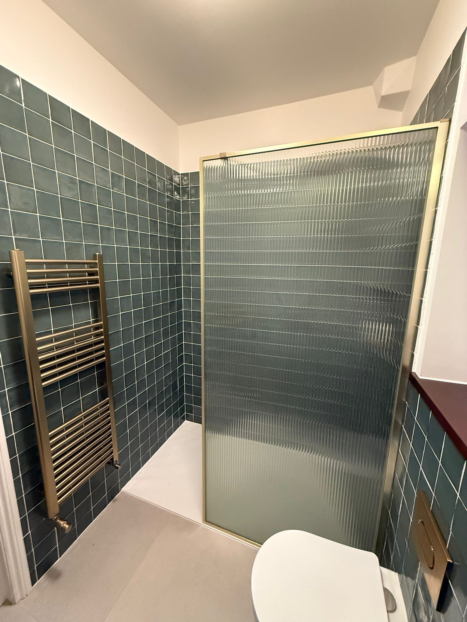 Walk-in shower reeded glass panel and towel rail, North London