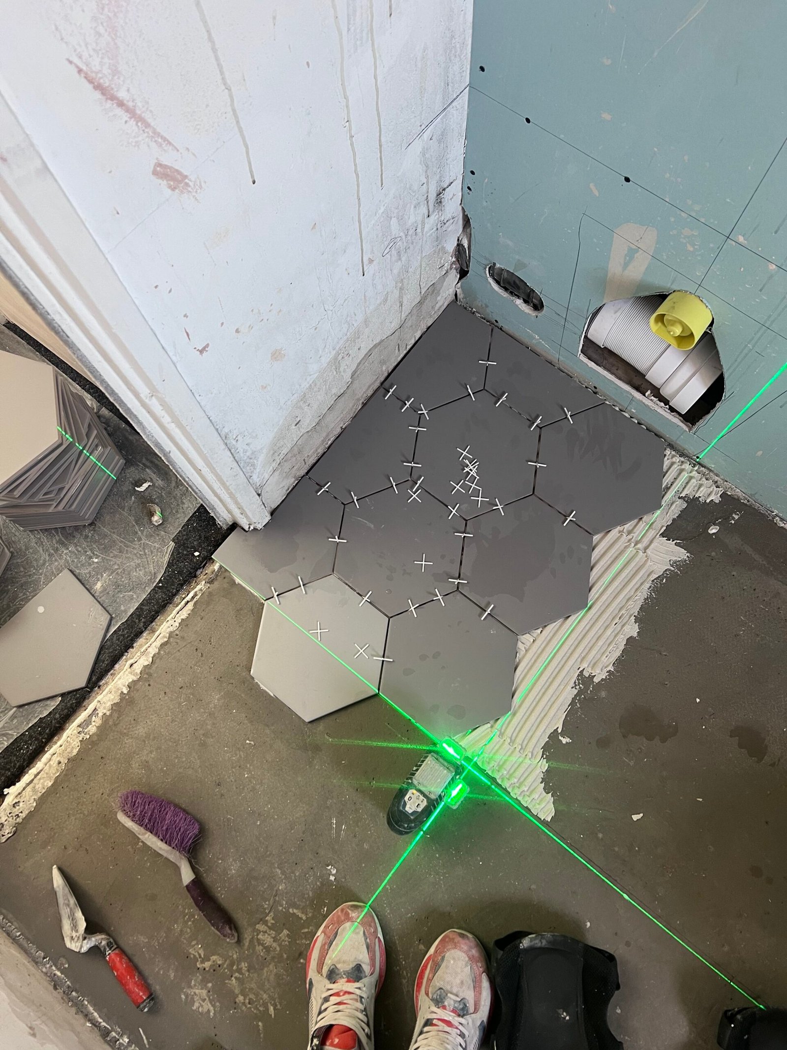 Hexagon floor tiling setout with laser level, Crouch End